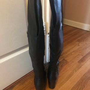 Black heeled over the knee studded boots